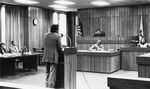 Male student arguing in Moot Court. by University of New Mexico School of Law